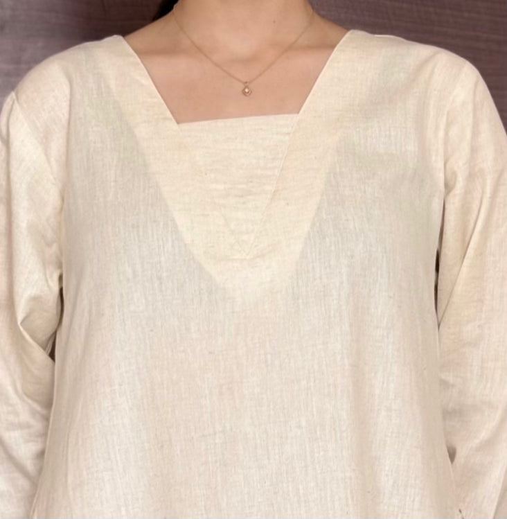 Sukoon-e-Qalb - White Khaadi Pheran Kurti with Delicate floral pocket embroidery.