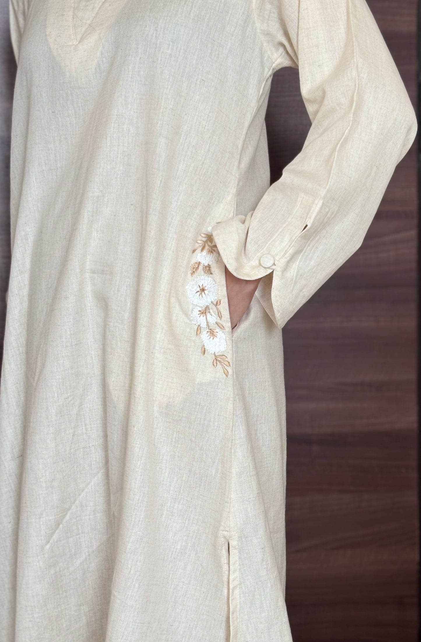 Sukoon-e-Qalb - White Khaadi Pheran Kurti with Delicate floral pocket embroidery.