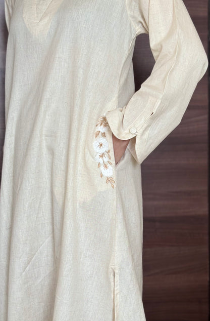 Sukoon-e-Qalb - White Khaadi Pheran Kurti with Delicate floral pocket embroidery.