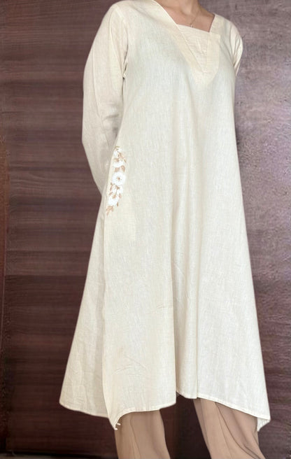 Sukoon-e-Qalb - White Khaadi Pheran Kurti with Delicate floral pocket embroidery.